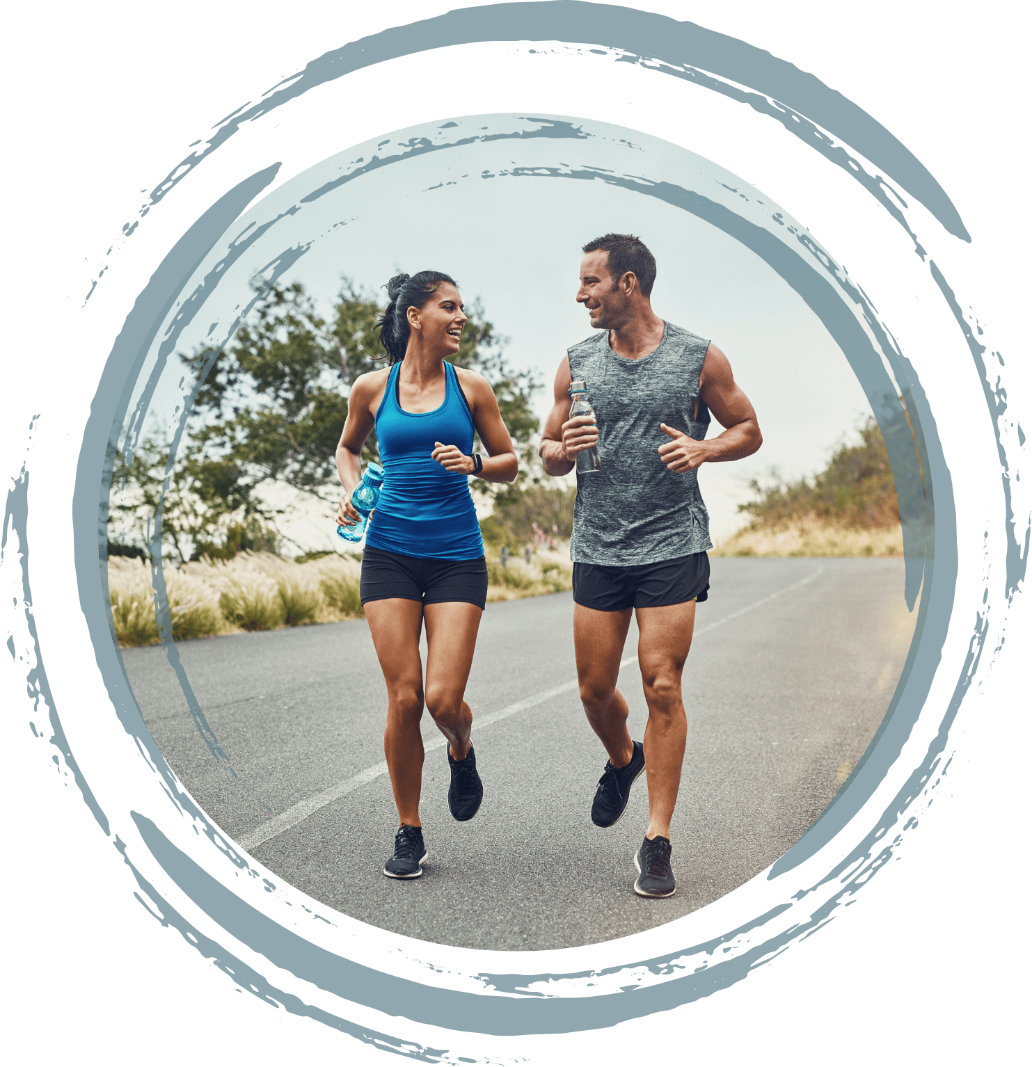 Two people going for a jog together, they are both holding a bottle of water.