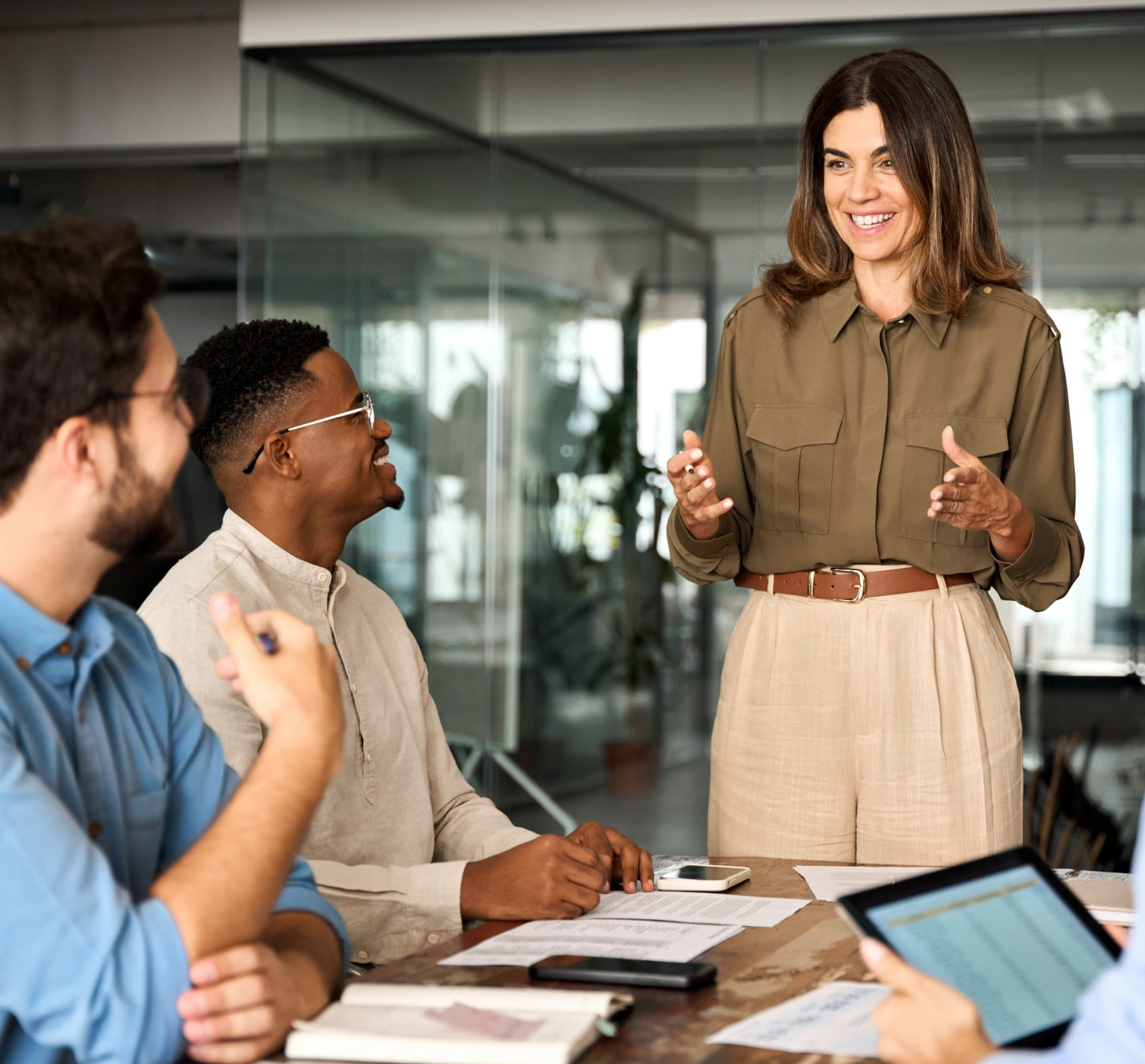 A lady giving a presentation to a group of people